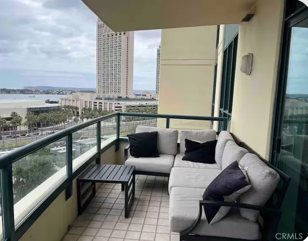a balcony with furniture and city view