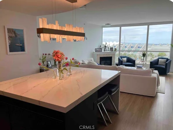 a room with furniture pool table and flat screen tv