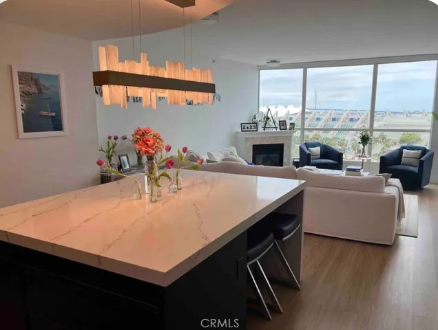 a room with furniture pool table and flat screen tv