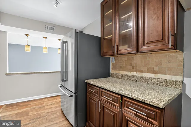 a kitchen with a sink and a refrigerator