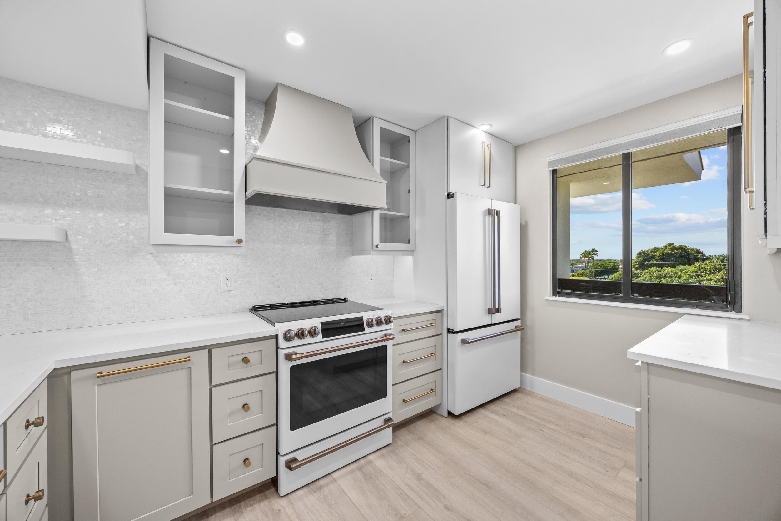 401 South Seas Drive, Unit 505 Jupiter, FL 33477 - Photo 16 of 39 a kitchen with stainless steel appliances a stove and a refrigerator