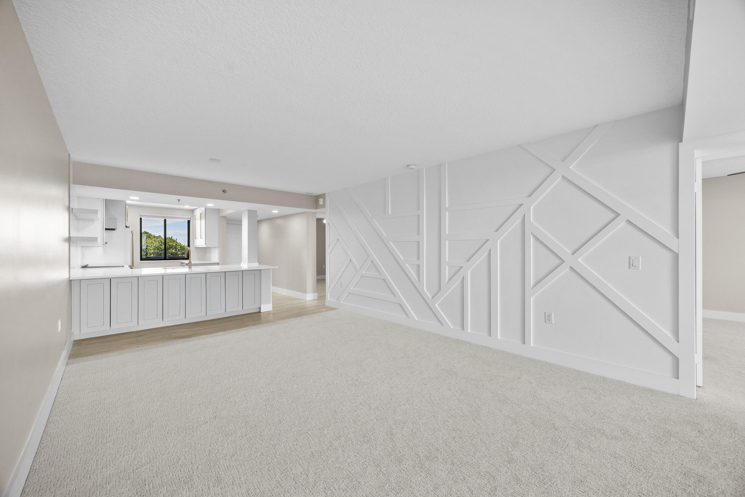401 South Seas Drive, Unit 505 Jupiter, FL 33477 - Photo 20 of 39 a view of an empty room with kitchen