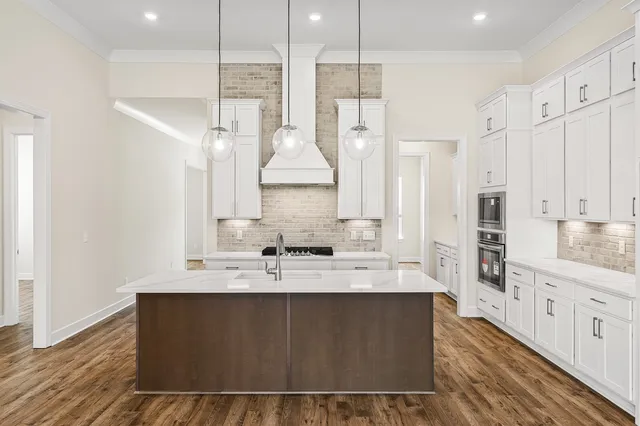 a large bathroom with a double vanity sink a mirror and a shower