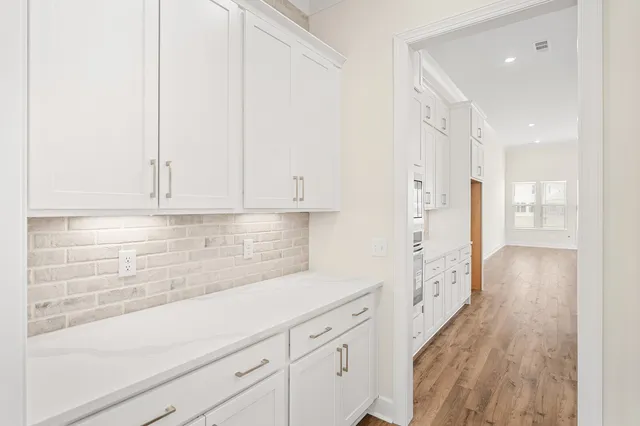 a view of a kitchen and utility room