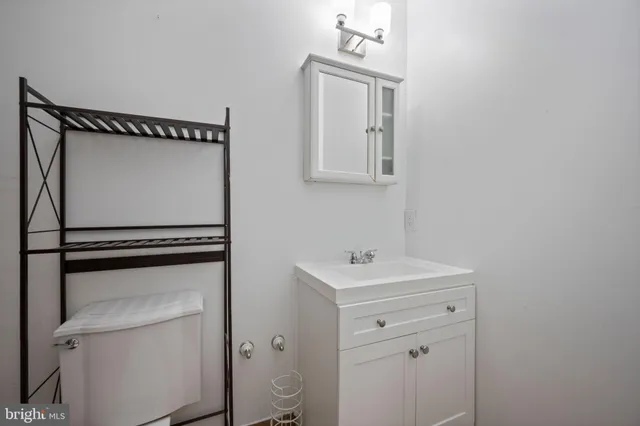 a bathroom with a toilet and a bathtub