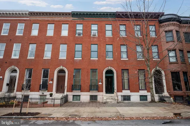 a front view of a building with garage