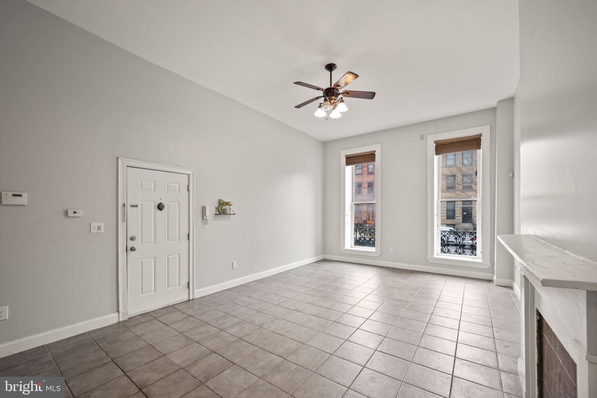 2422 Madison Avenue, Unit 1 Baltimore, MD 21217 - Photo 22 of 34 a view of an empty room with a window