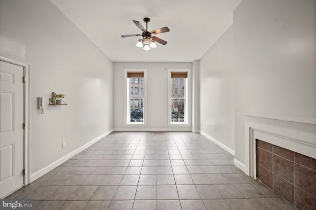 a view of hallway with stairs and a chandelier