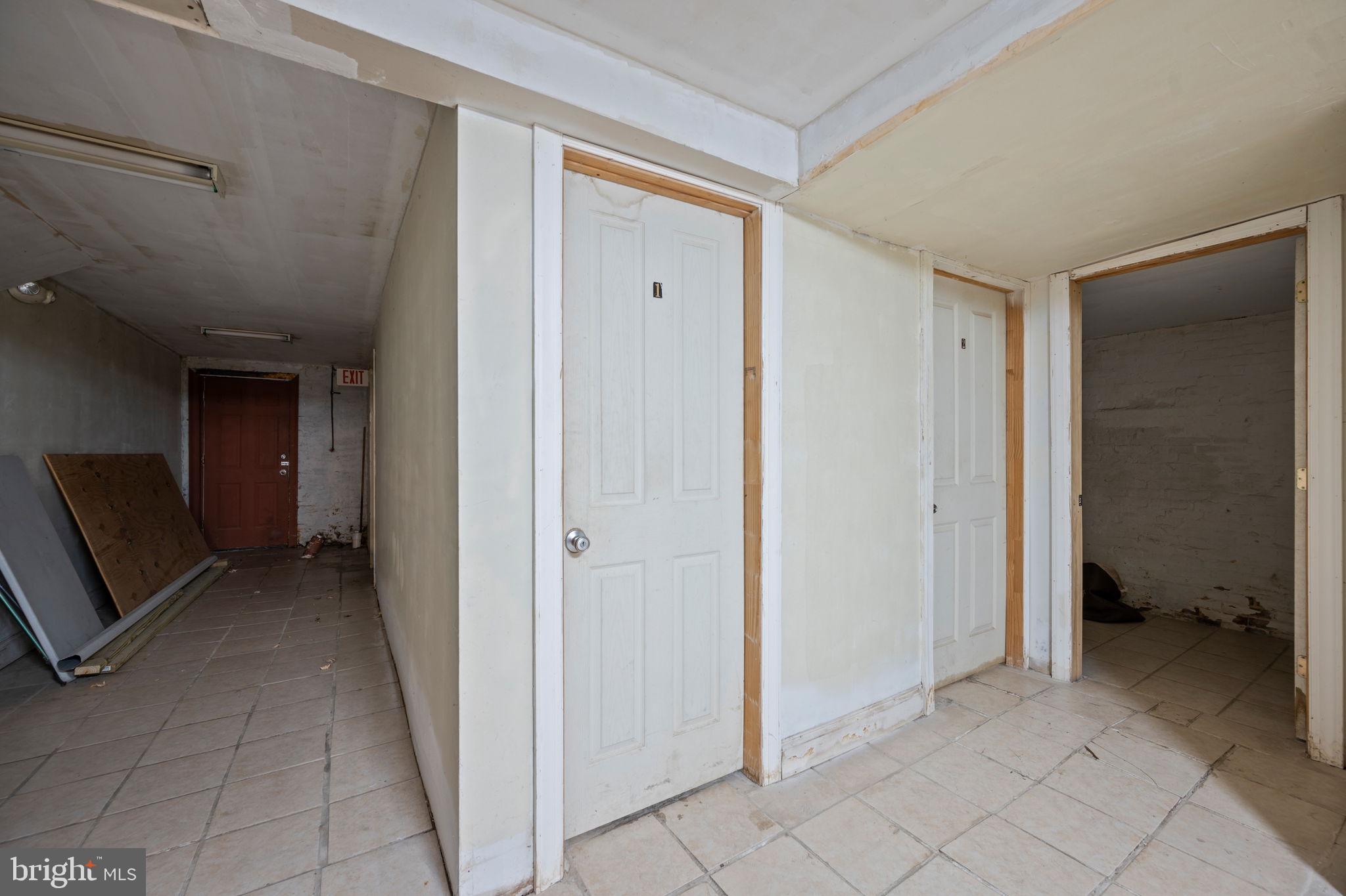 2422 Madison Avenue, Unit 1 Baltimore, MD 21217 - Photo 26 of 34 a view of a hallway to rooms