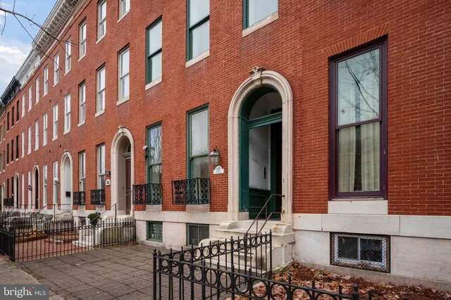 a front view of a building with large windows