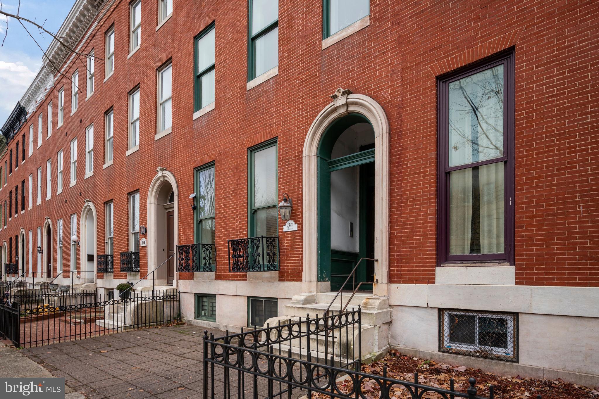 2422 Madison Avenue, Unit 1 Baltimore, MD 21217 - Photo 3 of 34 a front view of a building with large windows