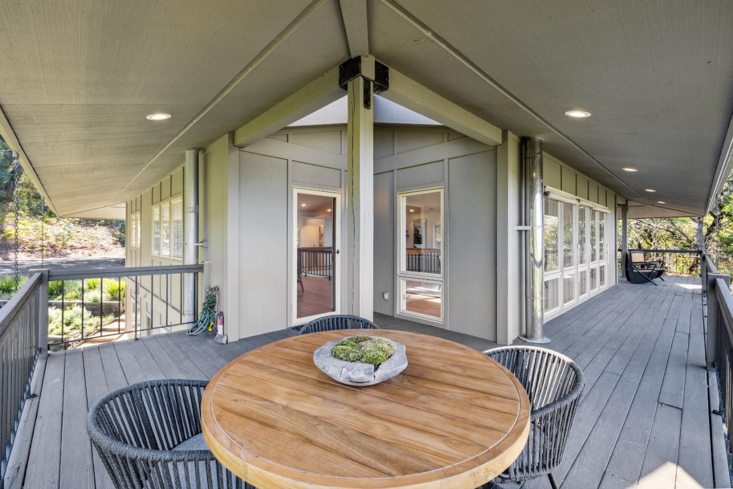 33 Bear Glen Drive Woodside, CA 94062 - Photo 16 of 33 a table and chairs in a patio