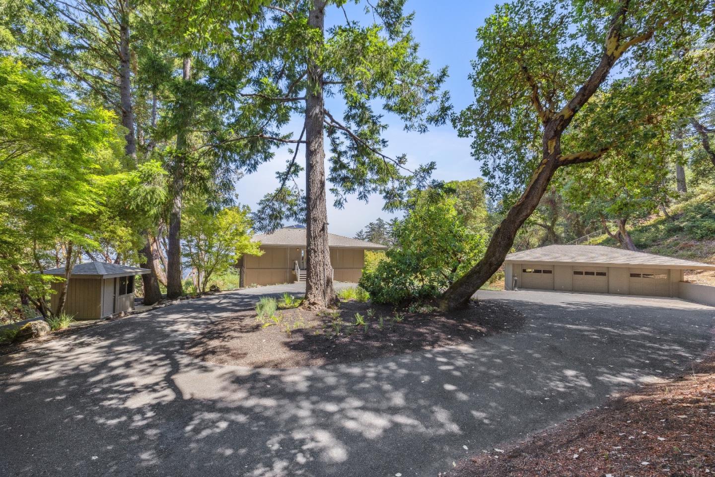 33 Bear Glen Drive Woodside, CA 94062 - Photo 30 of 33 a view of a house with a tree in the background