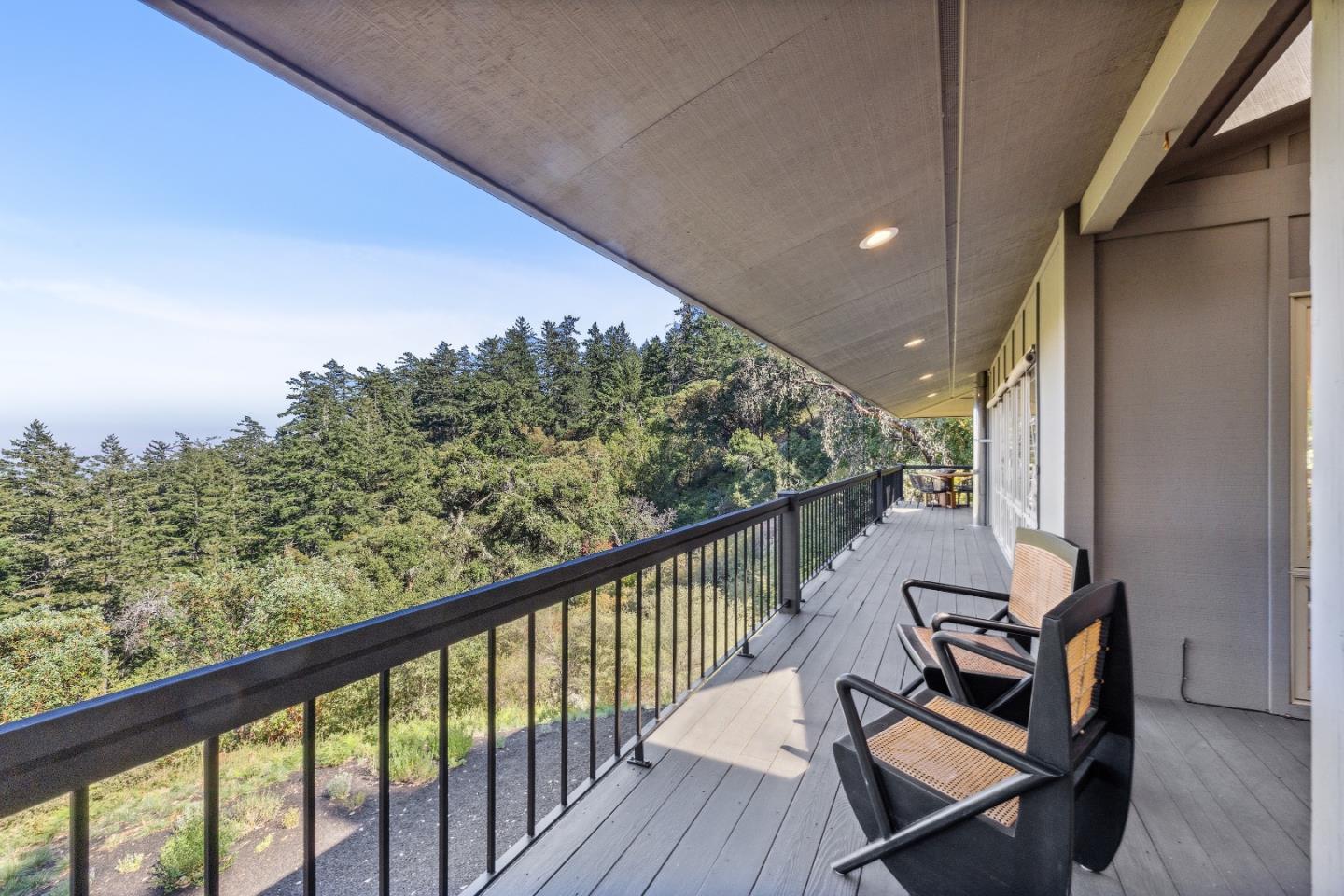 33 Bear Glen Drive Woodside, CA 94062 - Photo 9 of 33 a view of a balcony with chairs and wooden floor