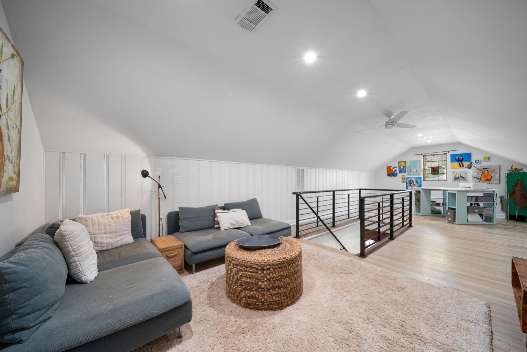 267 North Rose Road Memphis, TN 38117 - Photo 16 of 40 a living room with furniture and a book shelf
