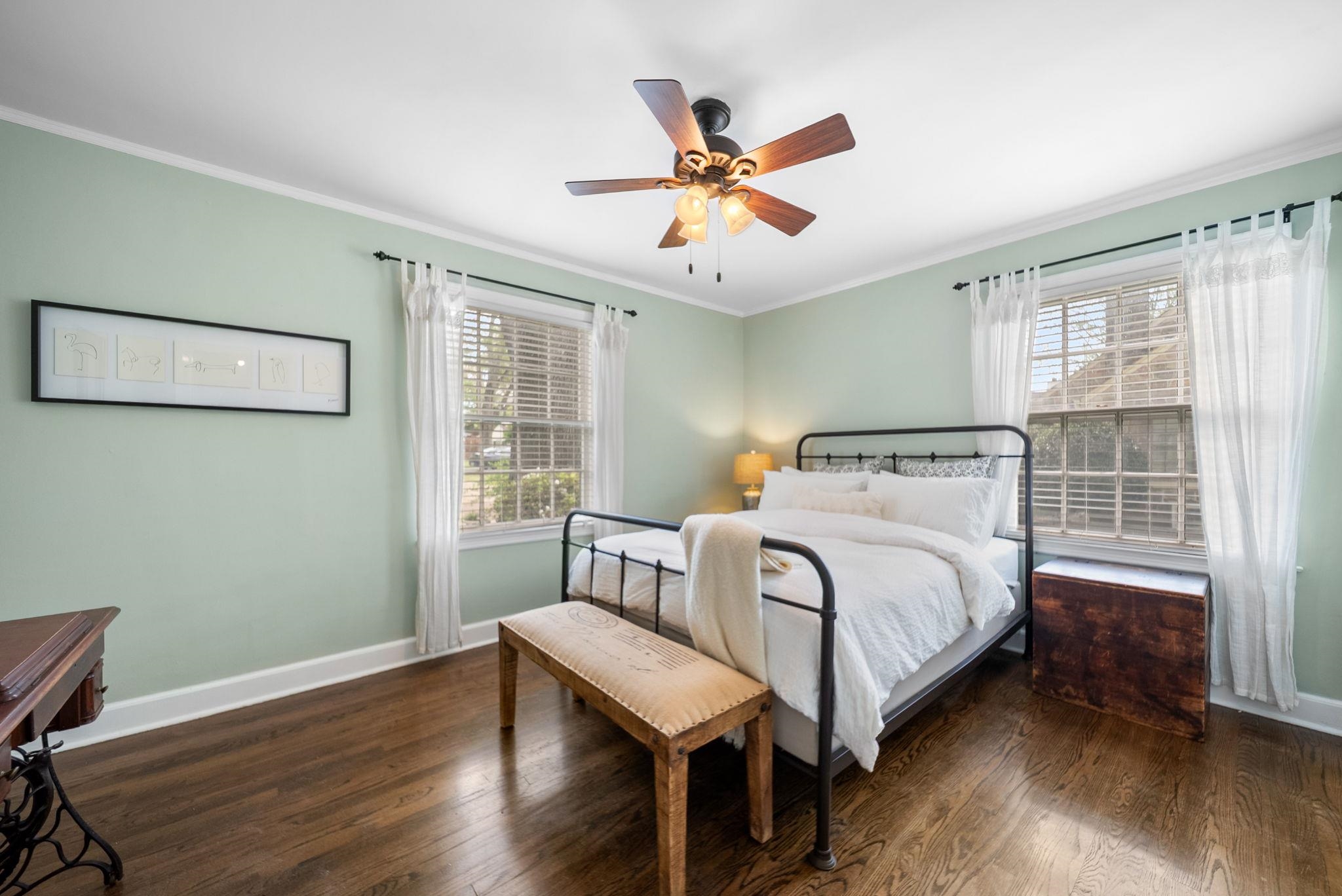 267 North Rose Road Memphis, TN 38117 - Photo 19 of 40 a bedroom with a bed and wooden floor