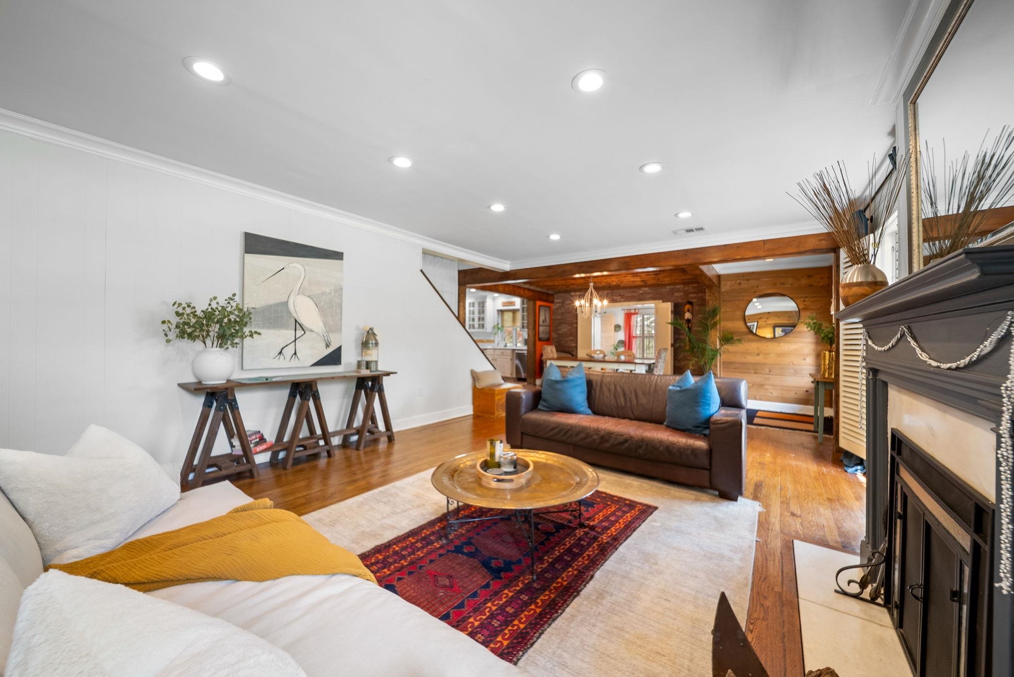 267 North Rose Road Memphis, TN 38117 - Photo 4 of 40 a living room with furniture a flat screen tv and a fireplace