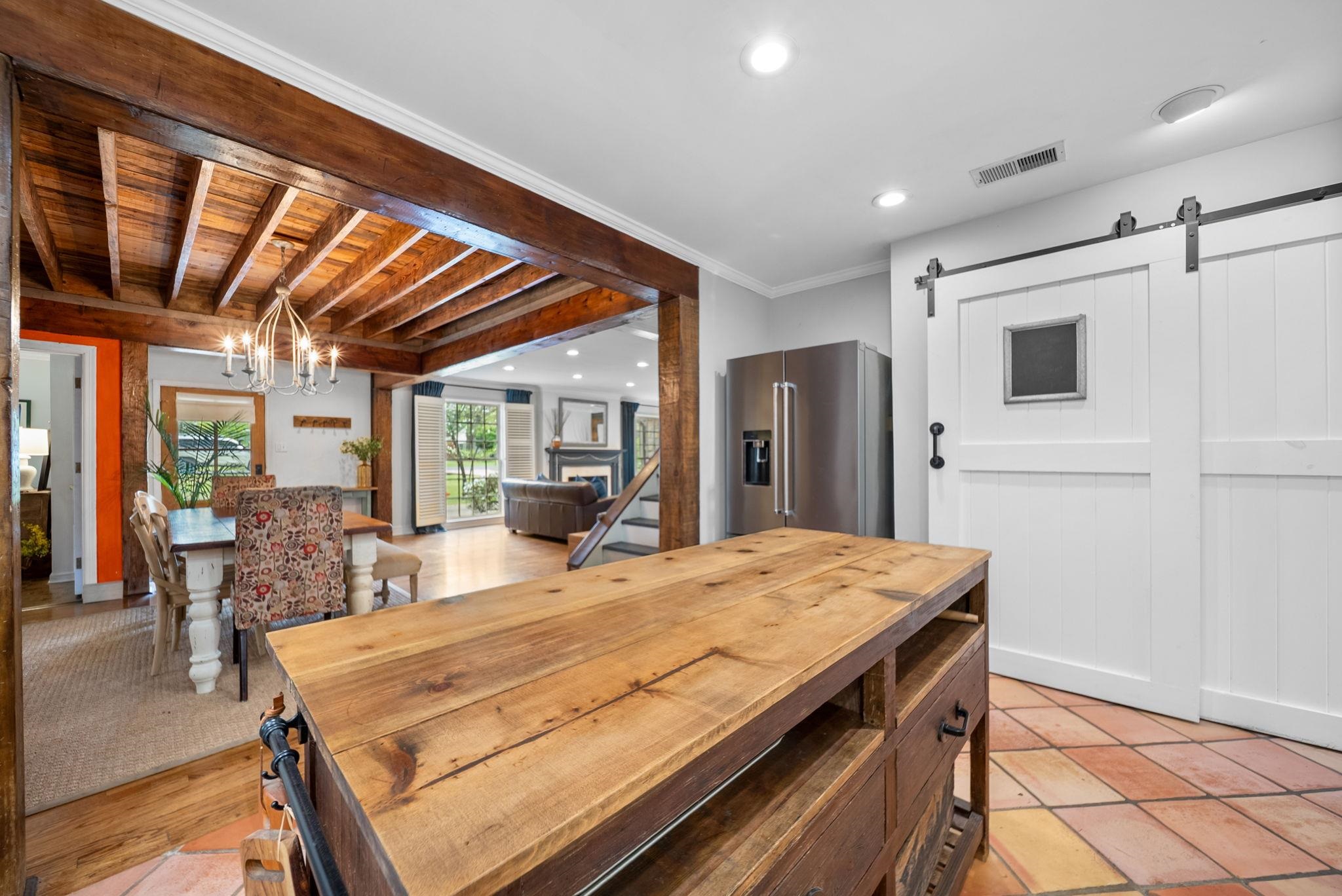 267 North Rose Road Memphis, TN 38117 - Photo 8 of 40 a room with a bed and a table with wooden floor