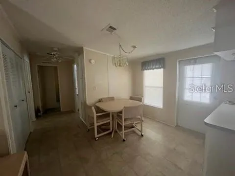 a view of a livingroom with furniture and window