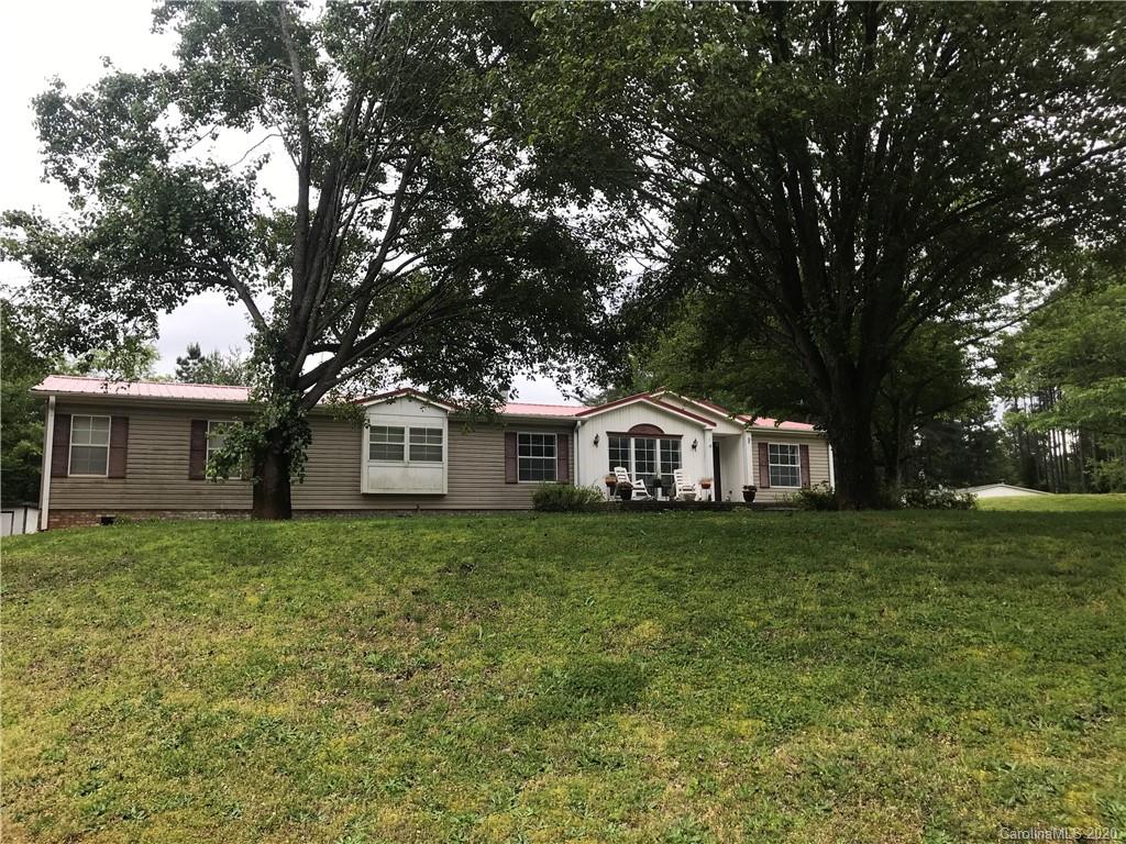 480 Hester Mill Road Rutherfordton, NC 28139 - Photo 1 of 38 a front view of a house with a garden