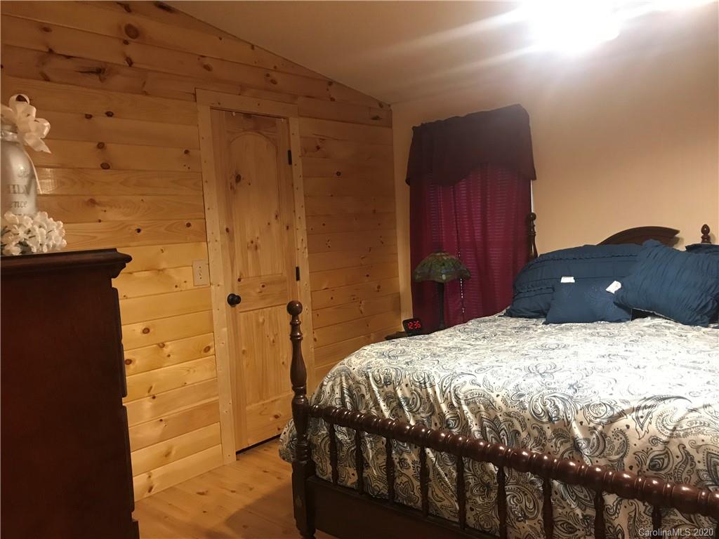480 Hester Mill Road Rutherfordton, NC 28139 - Photo 12 of 38 a bedroom with a bed and a cabinets
