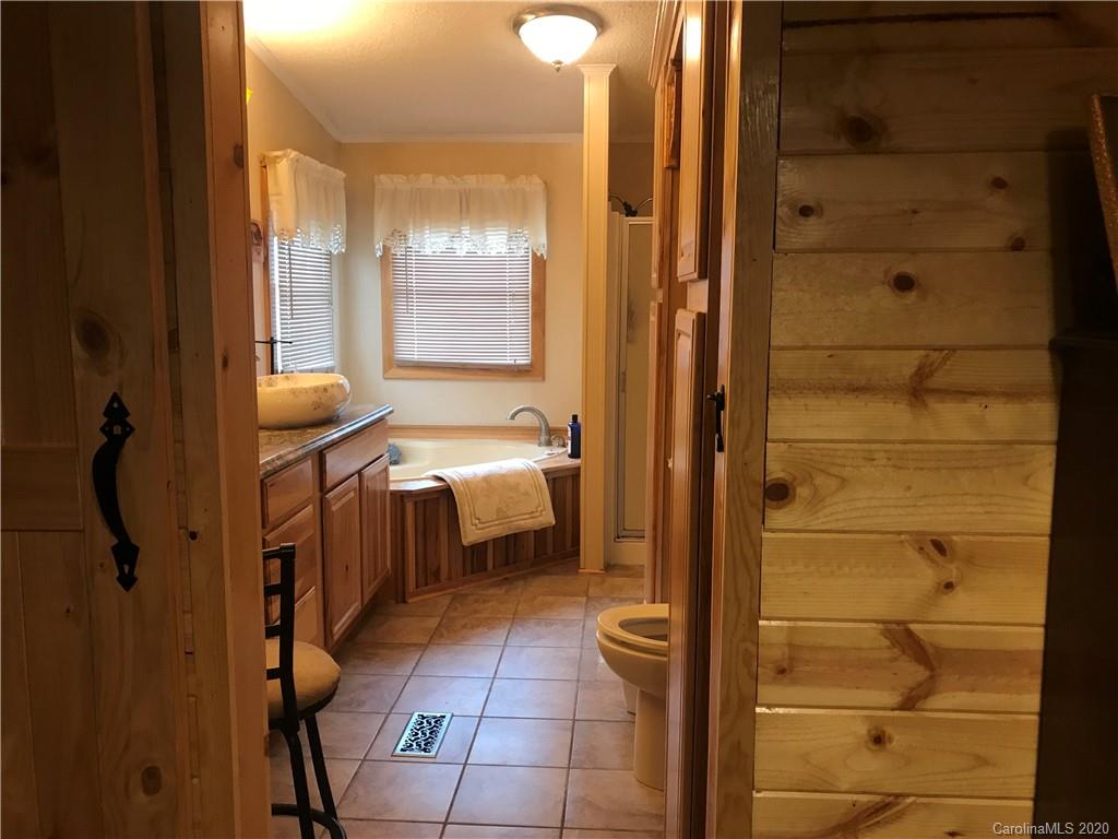 480 Hester Mill Road Rutherfordton, NC 28139 - Photo 16 of 38 a bathroom with a tub and shower