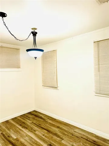 a view of a room with a window and ceiling fan