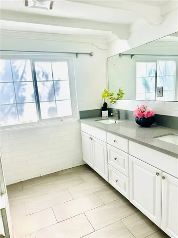 a kitchen with a cabinets and a window