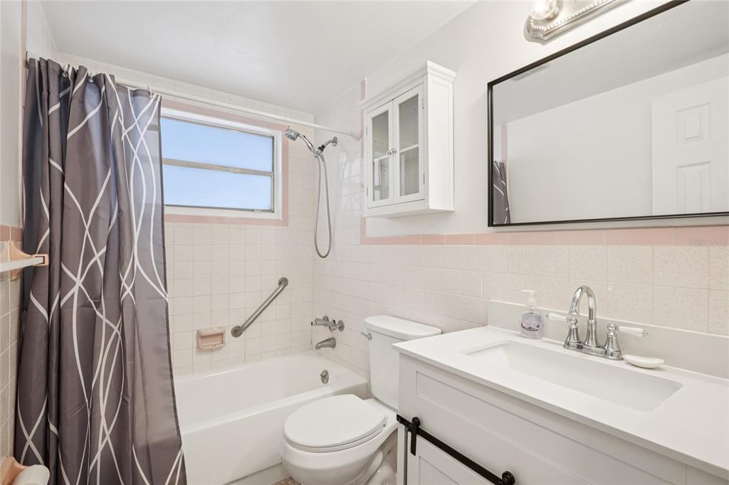 3548 Darlington Road Holiday, FL 34691 - Photo 20 of 32 a bathroom with a sink toilet a mirror and shower