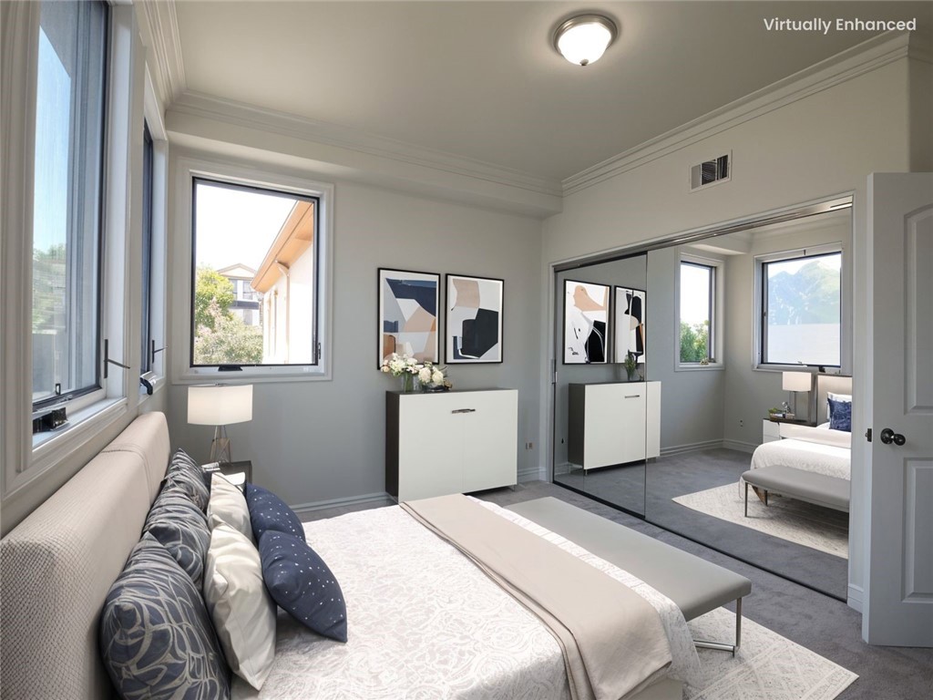 66 Allen Avenue, Unit 3 Pasadena, CA 91106 - Photo 12 of 25 a bedroom with a bed and glass windows