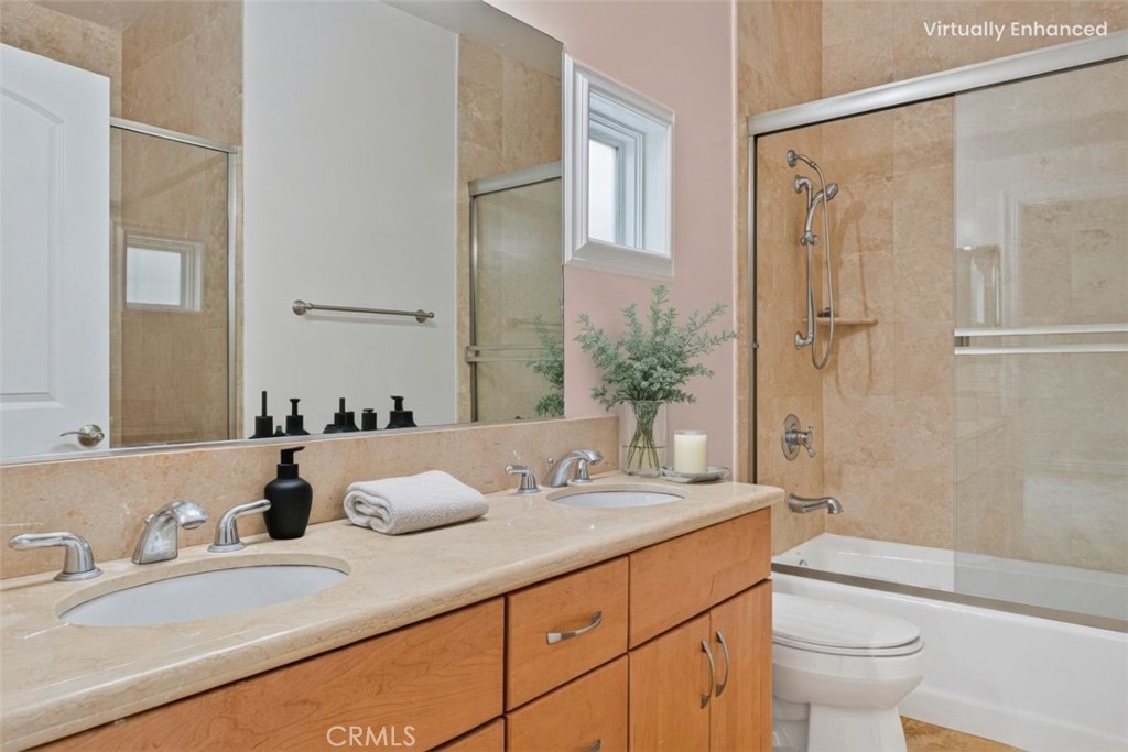 66 Allen Avenue, Unit 3 Pasadena, CA 91106 - Photo 19 of 25 a bathroom with a granite countertop sink toilet and shower