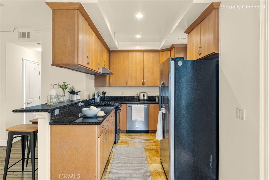 66 Allen Avenue, Unit 3 Pasadena, CA 91106 - Photo 22 of 25 a kitchen with stainless steel appliances granite countertop a refrigerator and a stove