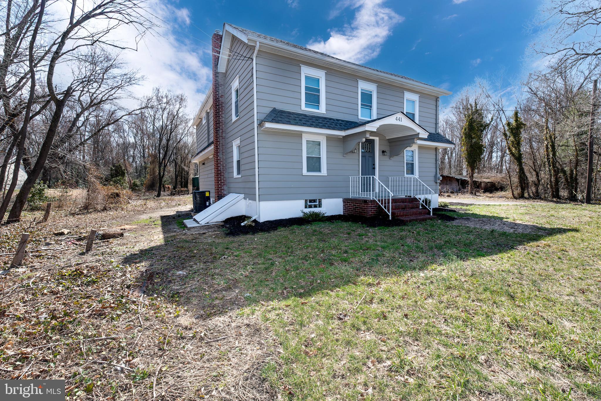 441 Harding Highway Pittsgrove, NJ 08318 - Photo 2 of 61 a front view of a house with a yard