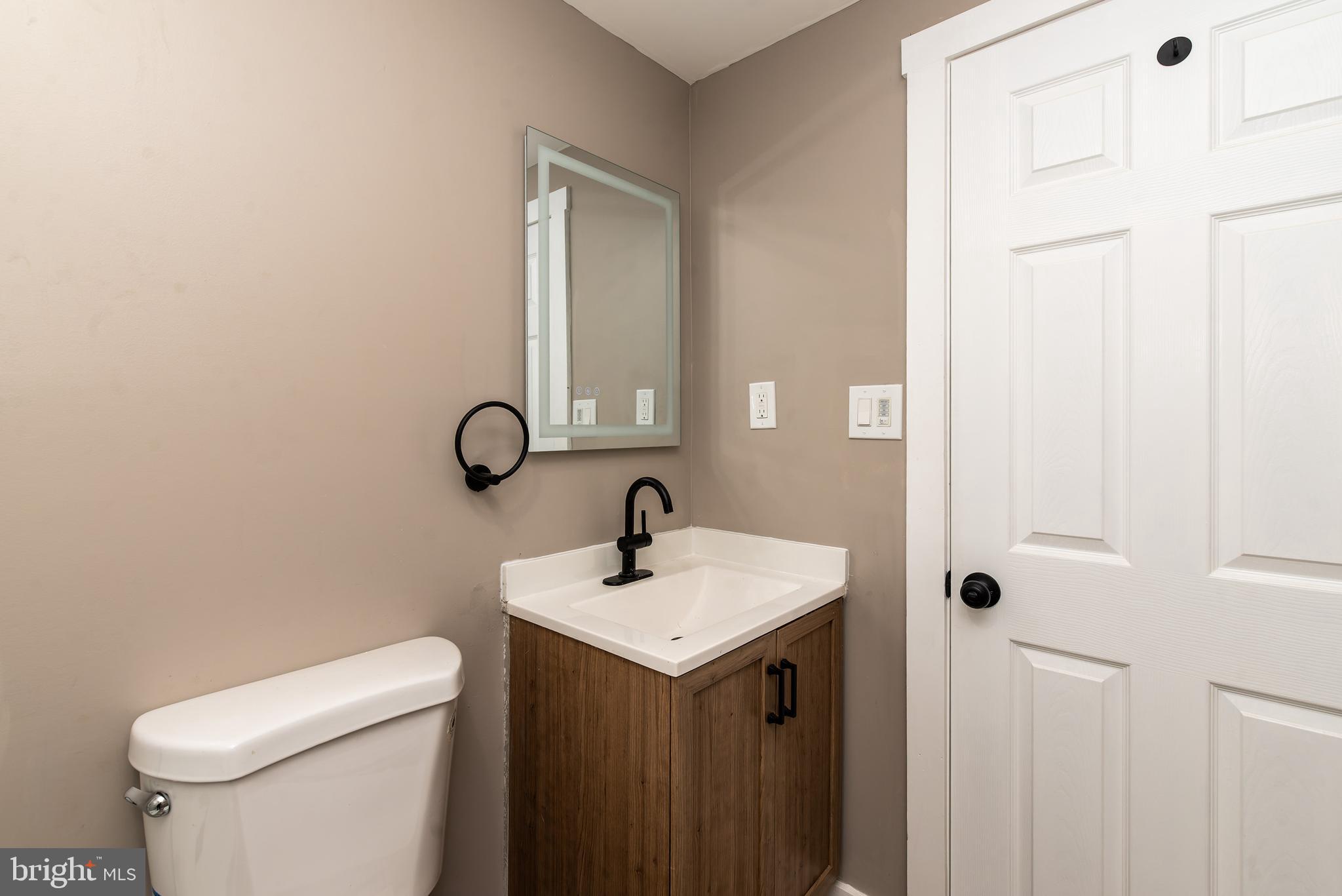 441 Harding Highway Pittsgrove, NJ 08318 - Photo 22 of 61 a bathroom with a toilet sink and mirror