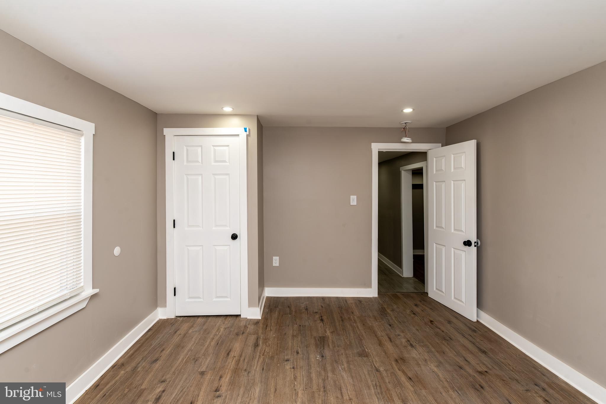 441 Harding Highway Pittsgrove, NJ 08318 - Photo 23 of 61 a view of an empty room with wooden floor and a window