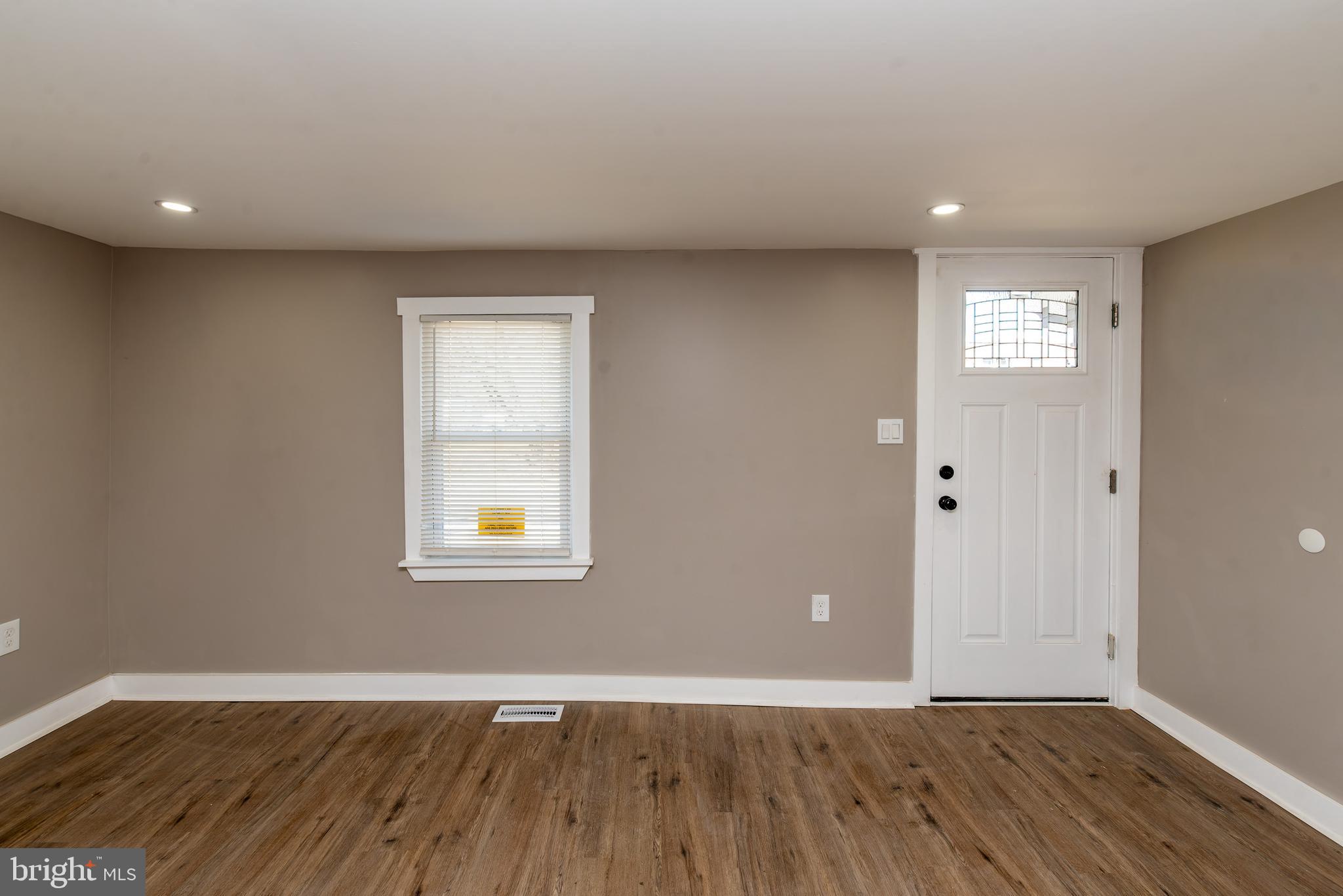 441 Harding Highway Pittsgrove, NJ 08318 - Photo 25 of 61 a view of an empty room with wooden floor and a window