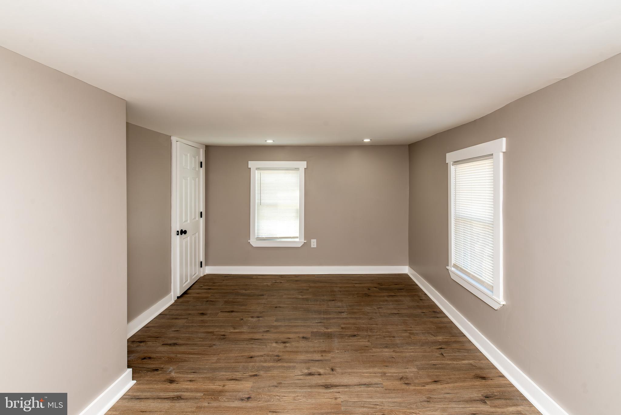 441 Harding Highway Pittsgrove, NJ 08318 - Photo 28 of 61 an empty room with wooden floor and windows