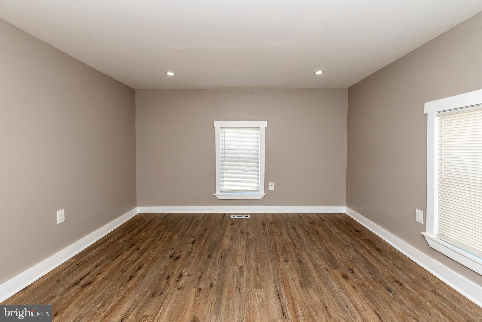 441 Harding Highway Pittsgrove, NJ 08318 - Photo 29 of 61 a view of an empty room with wooden floor and a window