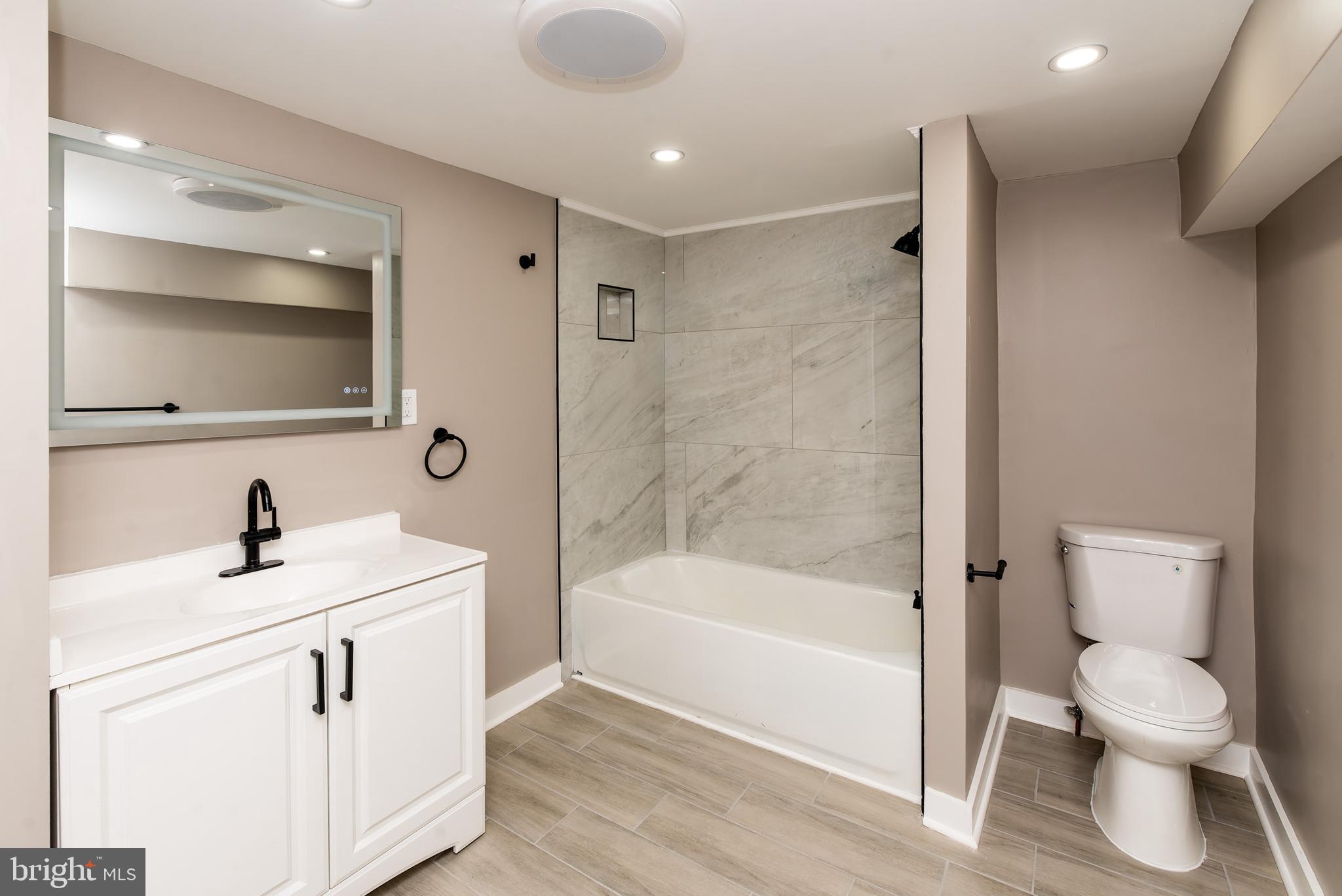 441 Harding Highway Pittsgrove, NJ 08318 - Photo 30 of 61 a bathroom with a sink a toilet and a bathtub
