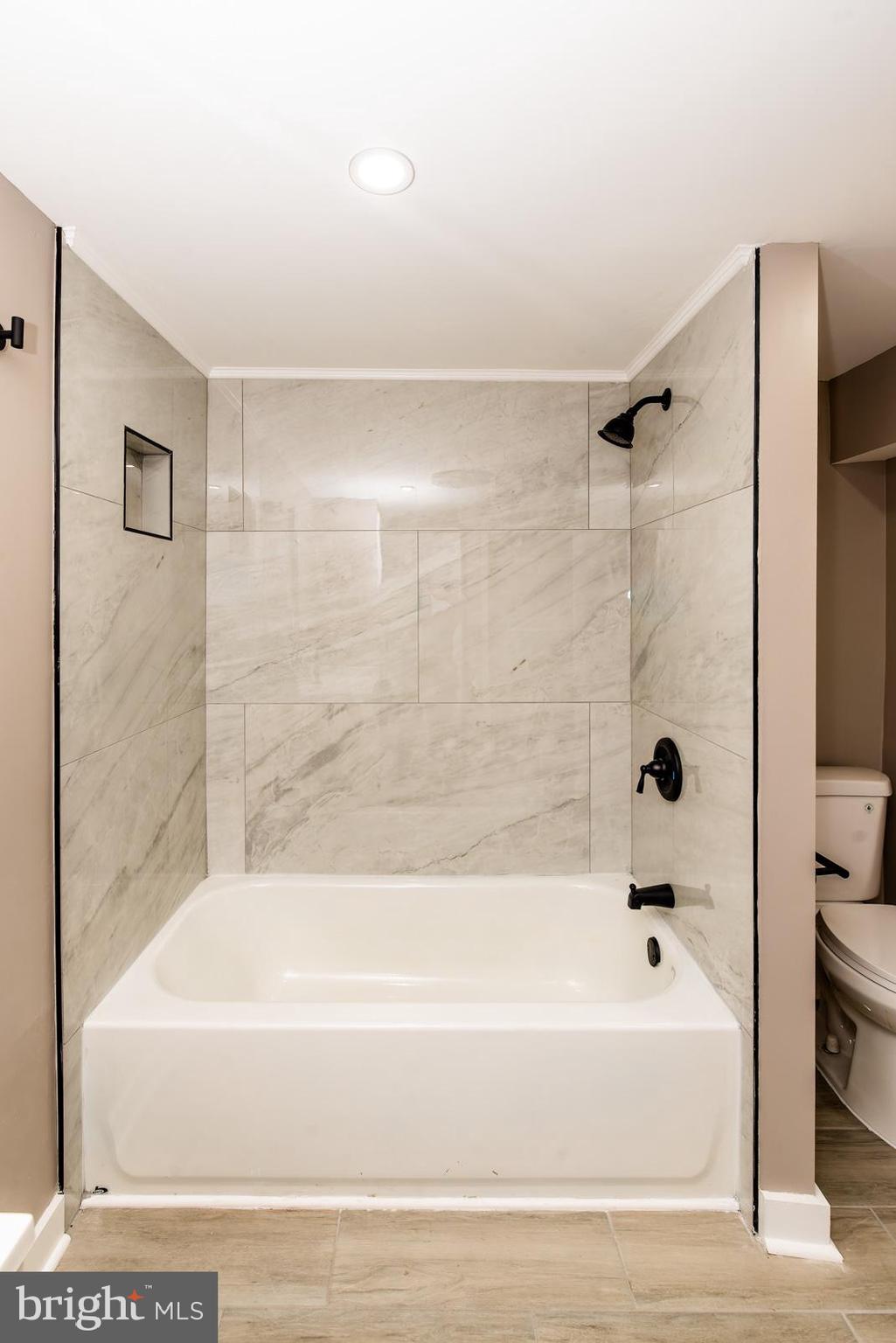 441 Harding Highway Pittsgrove, NJ 08318 - Photo 32 of 61 a bathroom with a bathtub and a shower