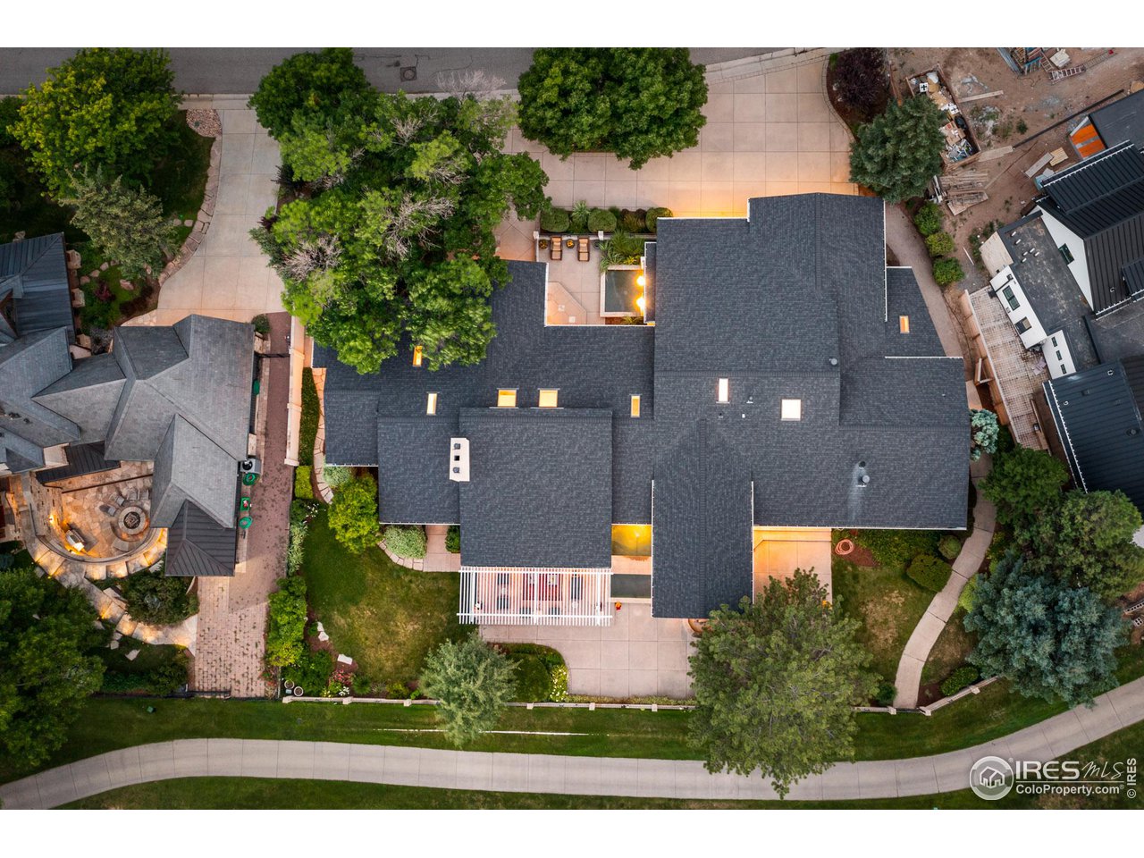 an aerial view of multiple houses with a yard