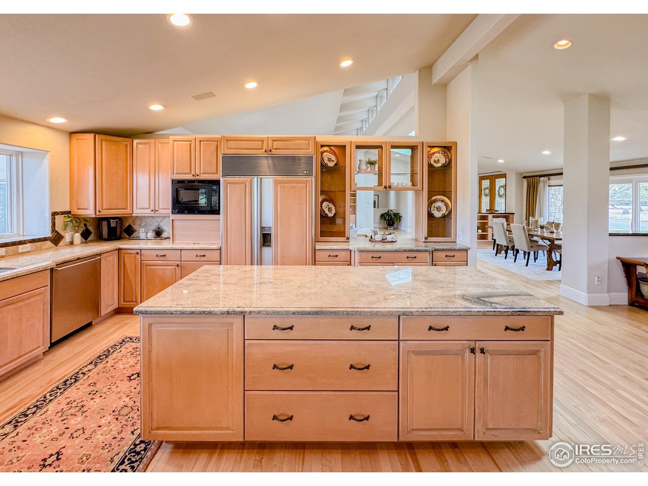7155 Rustic Trail Boulder, CO 80301 - Photo 15 of 40 a kitchen with granite countertop a sink and cabinets