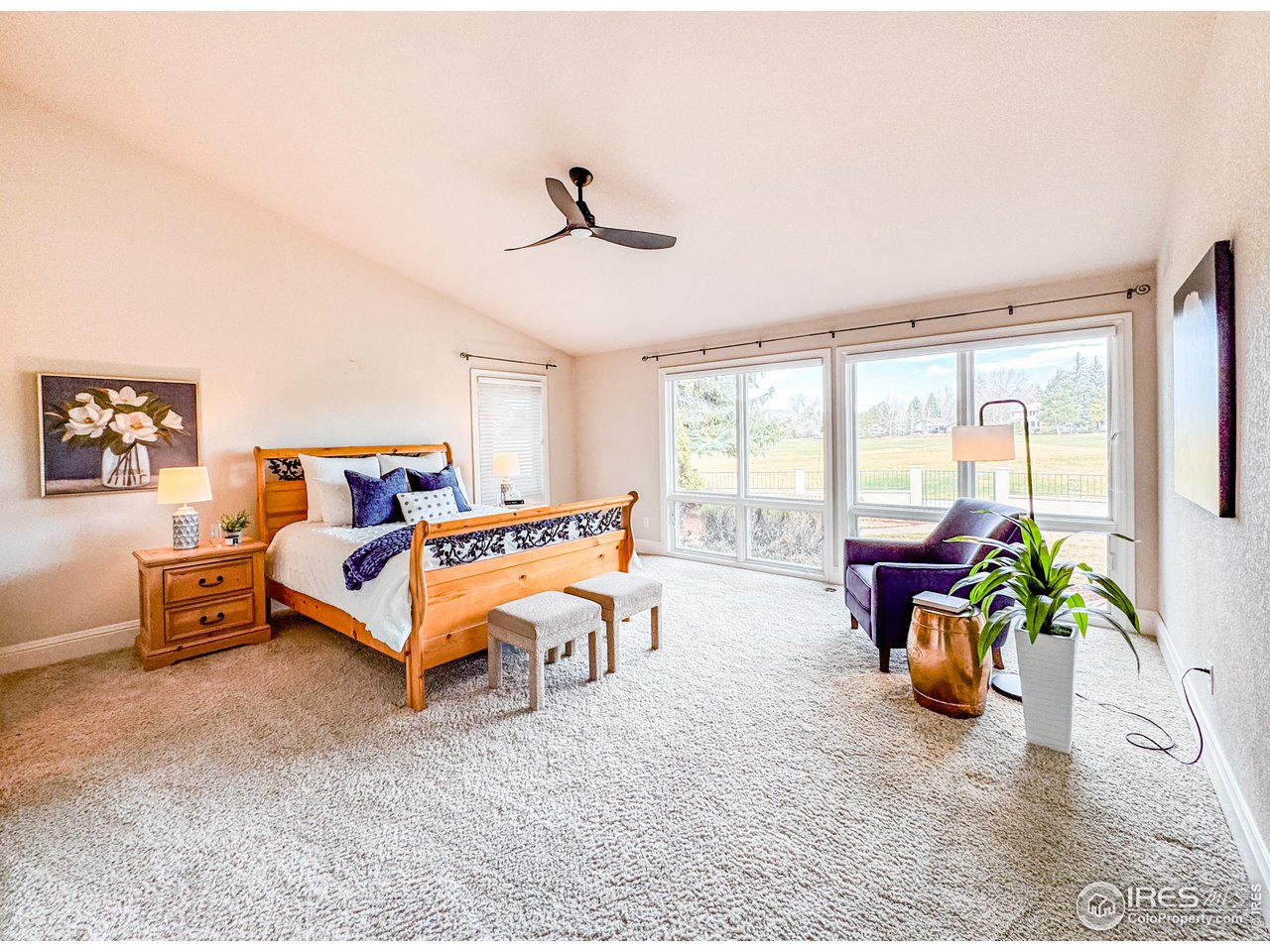 7155 Rustic Trail Boulder, CO 80301 - Photo 24 of 40 a bedroom with furniture and a large window