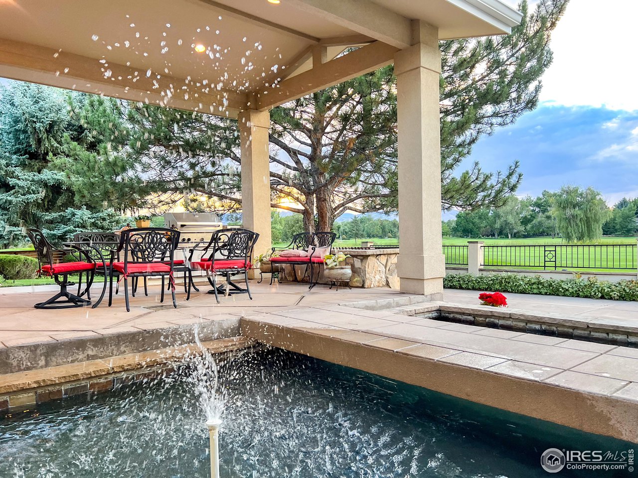 7155 Rustic Trail Boulder, CO 80301 - Photo 34 of 40 a street view with a garden and car parked