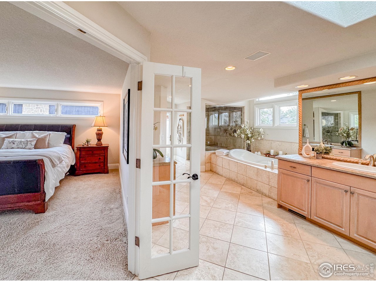 7155 Rustic Trail Boulder, CO 80301 - Photo 40 of 40 a bathroom with a tub sink and mirror