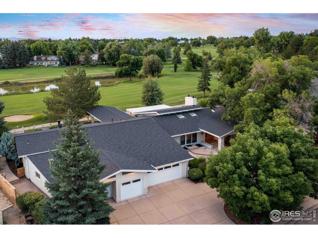 7155 Rustic Trail Boulder, CO 80301 - Photo 4 of 40 an aerial view of a house with a garden and lake view