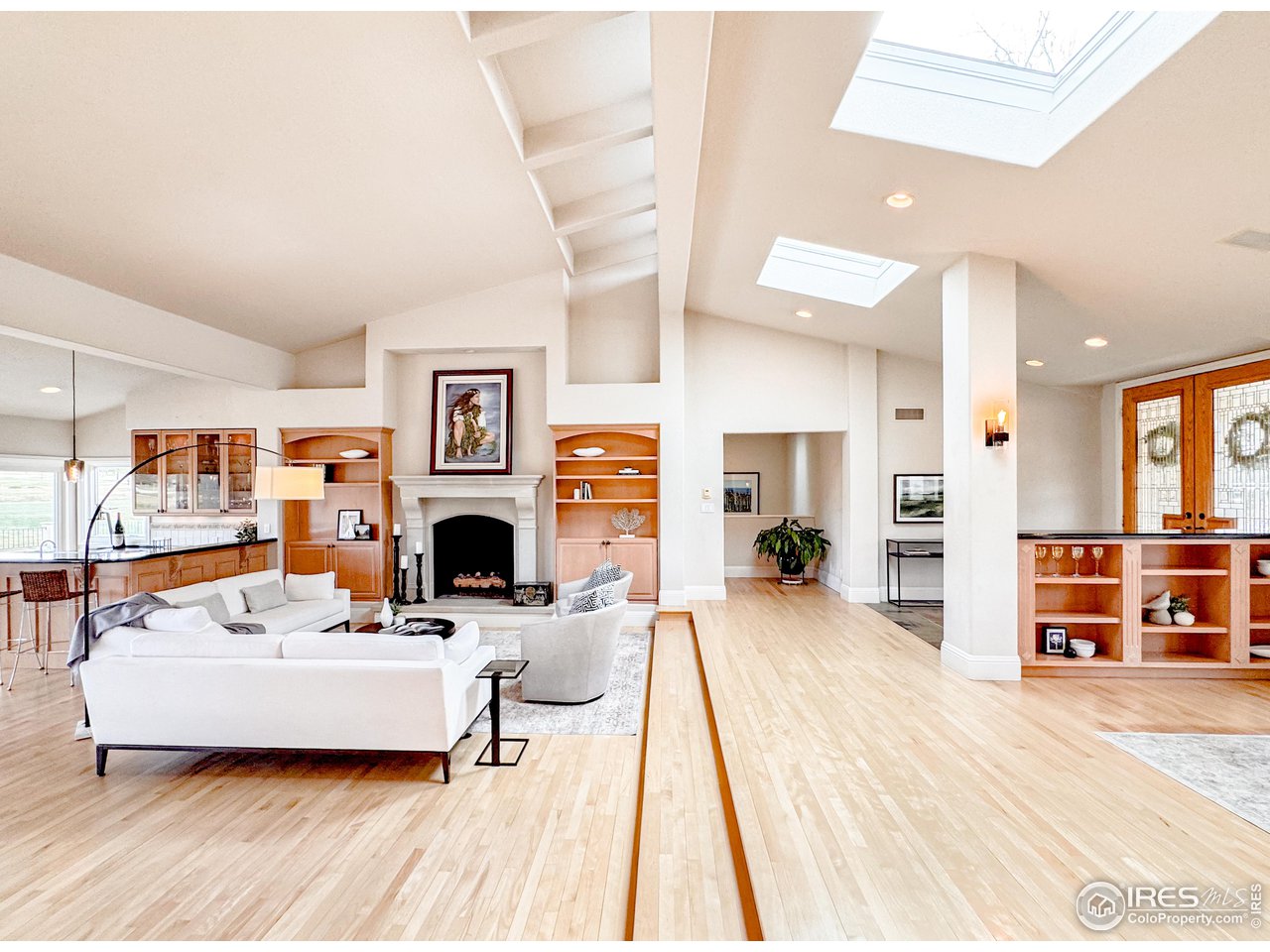 7155 Rustic Trail Boulder, CO 80301 - Photo 7 of 40 a living room with furniture and a fireplace with wooden floor