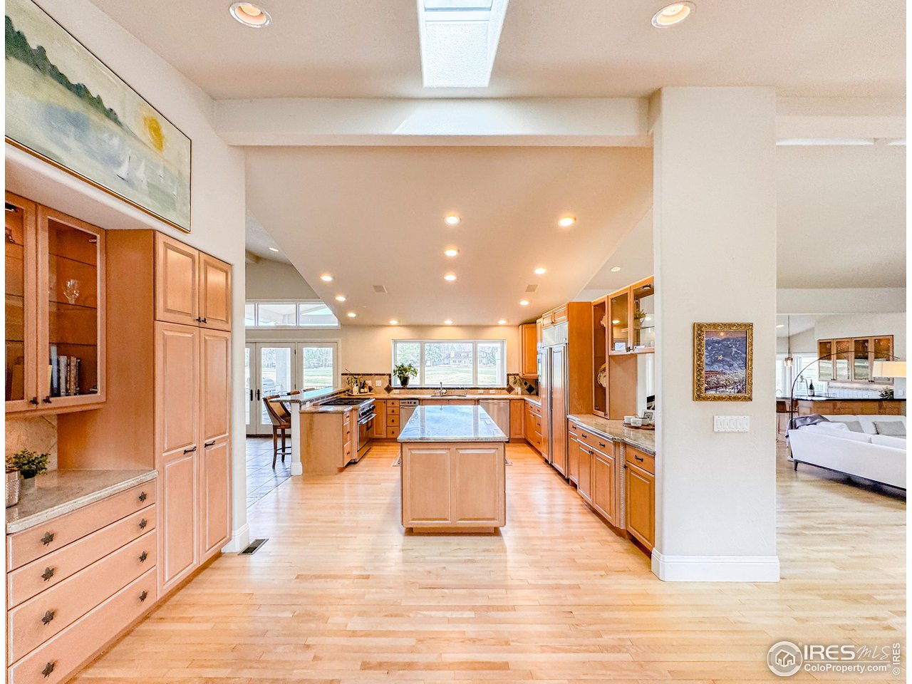 7155 Rustic Trail Boulder, CO 80301 - Photo 8 of 40 a view of a living room kitchen and a wooden floor