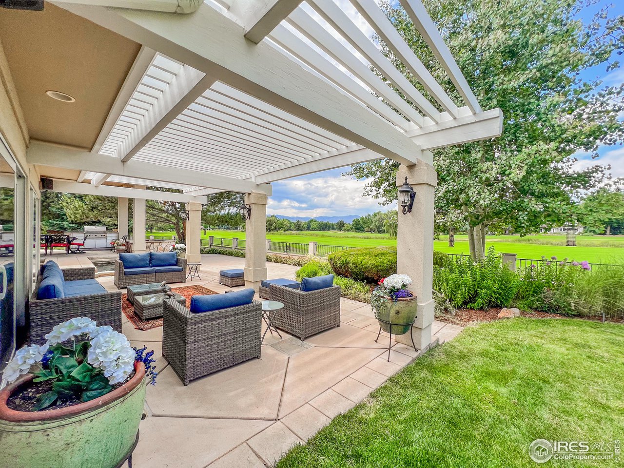 7155 Rustic Trail Boulder, CO 80301 - Photo 10 of 40 a view of a patio with couches chairs and potted plants