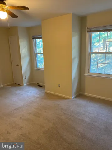 a view of an empty room with stairs